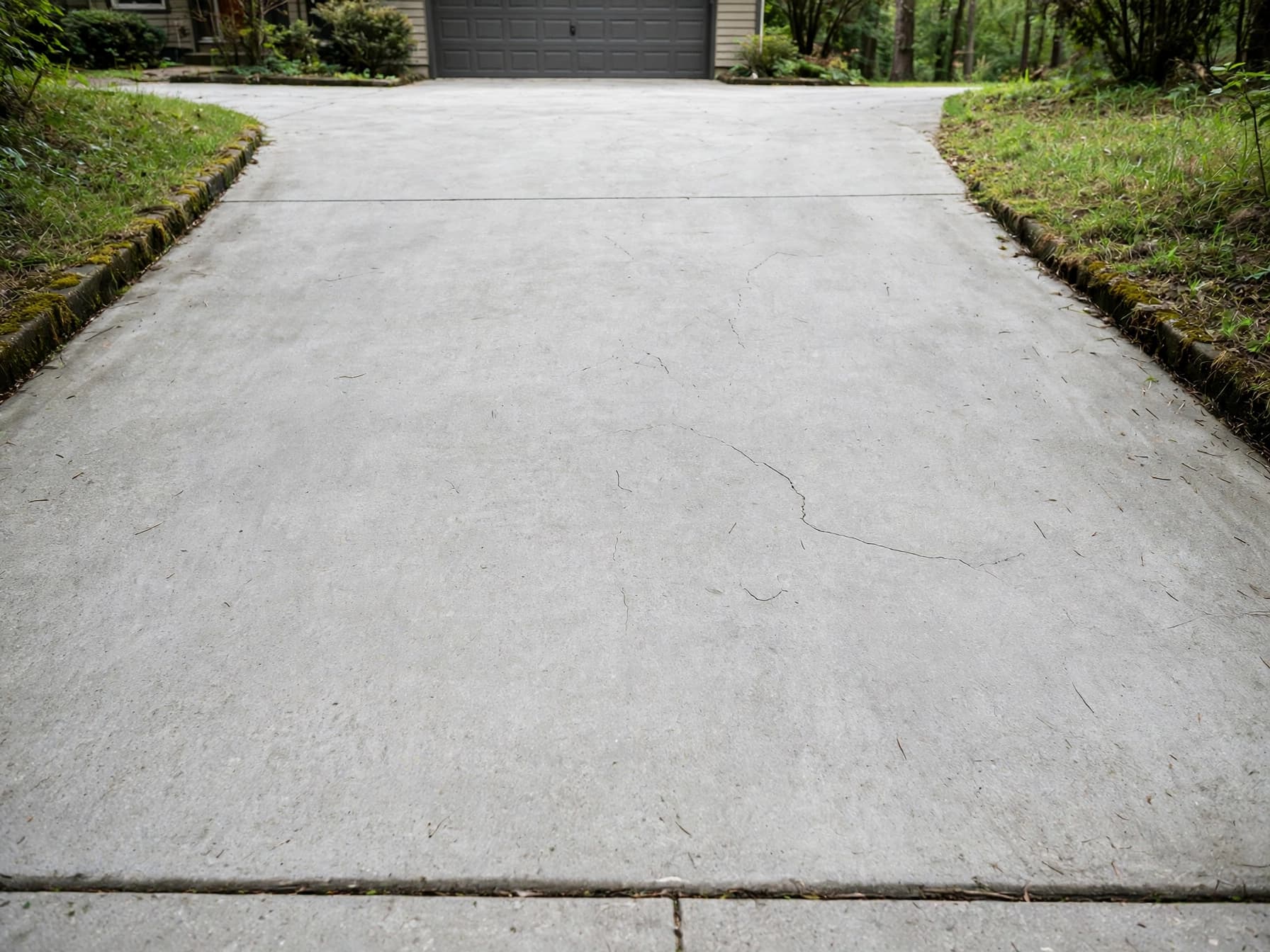 Dirty driveway after pressure washing