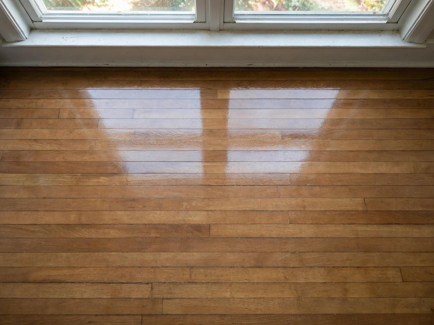 The same timber floor after cleaning, clean and polished